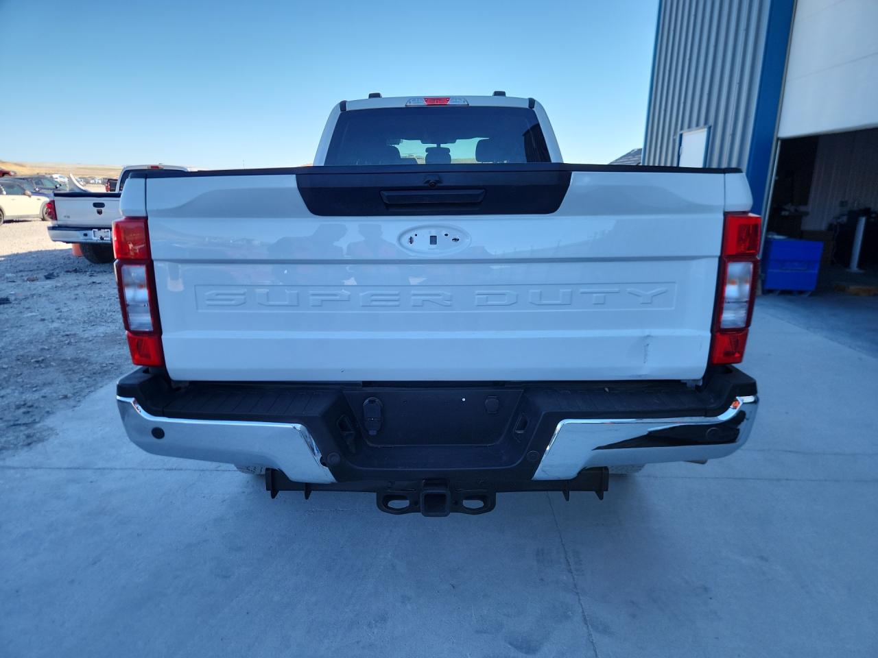 2021 Ford F250 Super Duty White vin: 1FT7W2BT1MED72780 Damage: Rear Emblem, Missing, Replacement Required