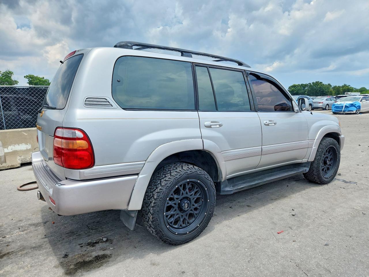 1999 Toyota Land Cruiser Base Gold vin: JT3HT05J5X0027141