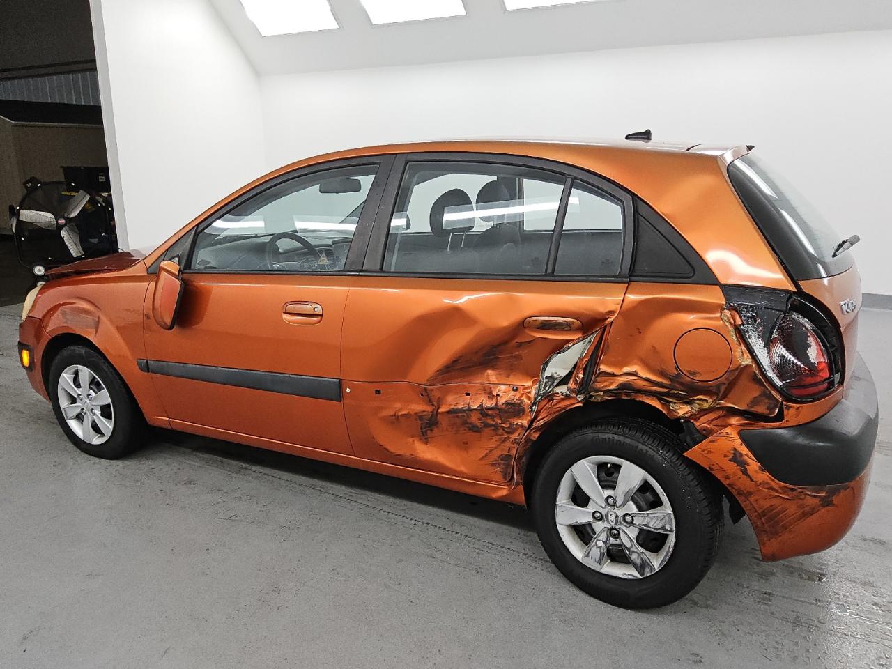2009 Kia Rio5 Lx Orange vin: KNADE243896567101 Damage: Left C Pillar, Kinked, 5 To 6 Inches