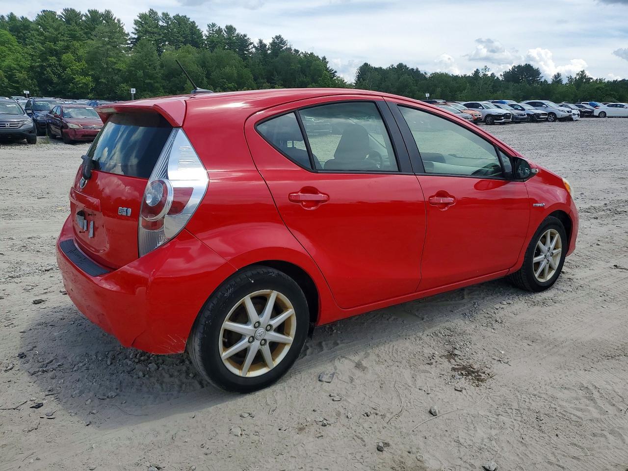 2012 Toyota Prius C Three Red vin: JTDKDTB31C1021590
