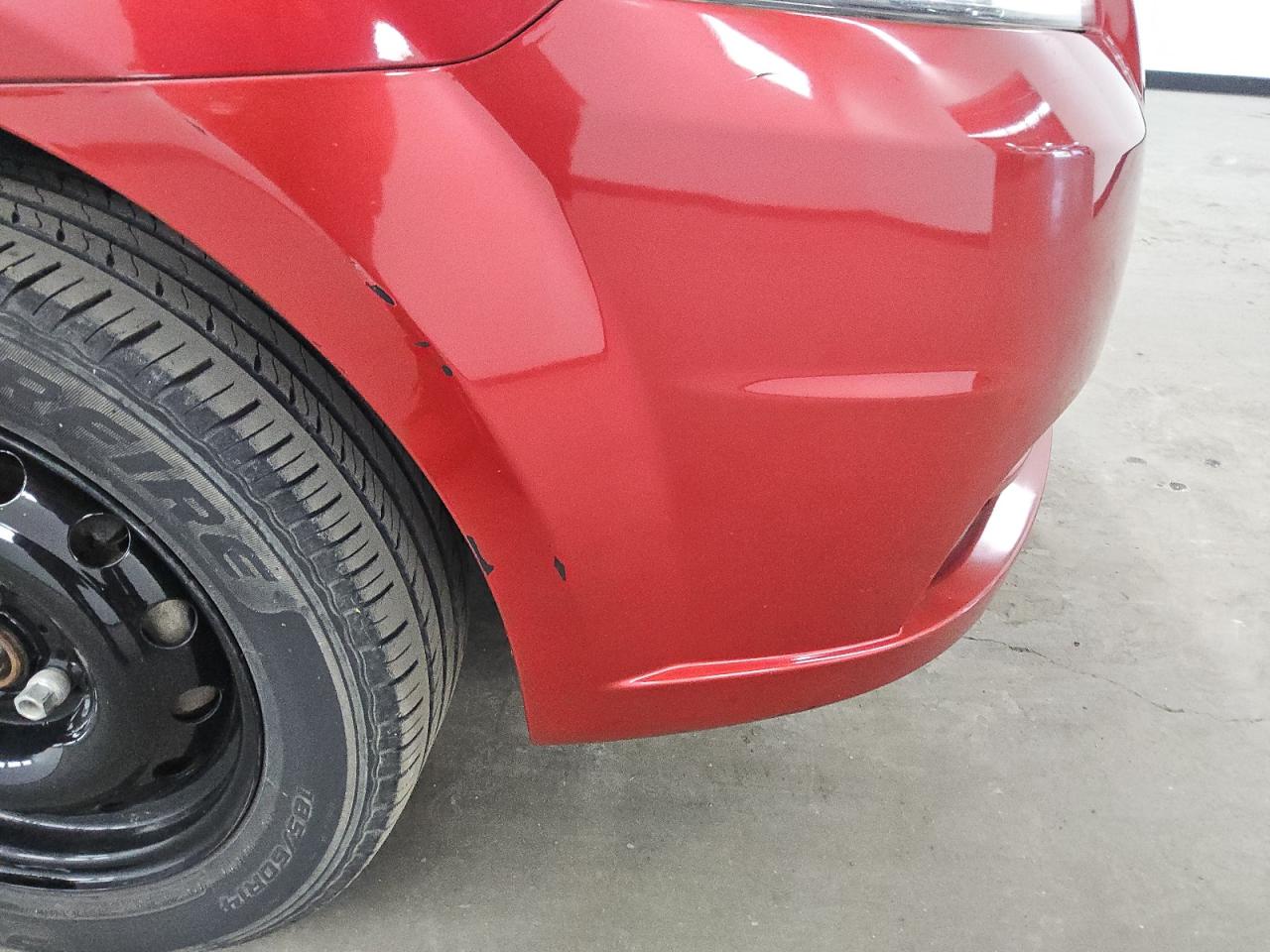 2011 Chevrolet Aveo Red vin: KL1TD5DE9BB220532 Damage: Front Bumper, Heavy Scratch, 1/2 To 1 Inch