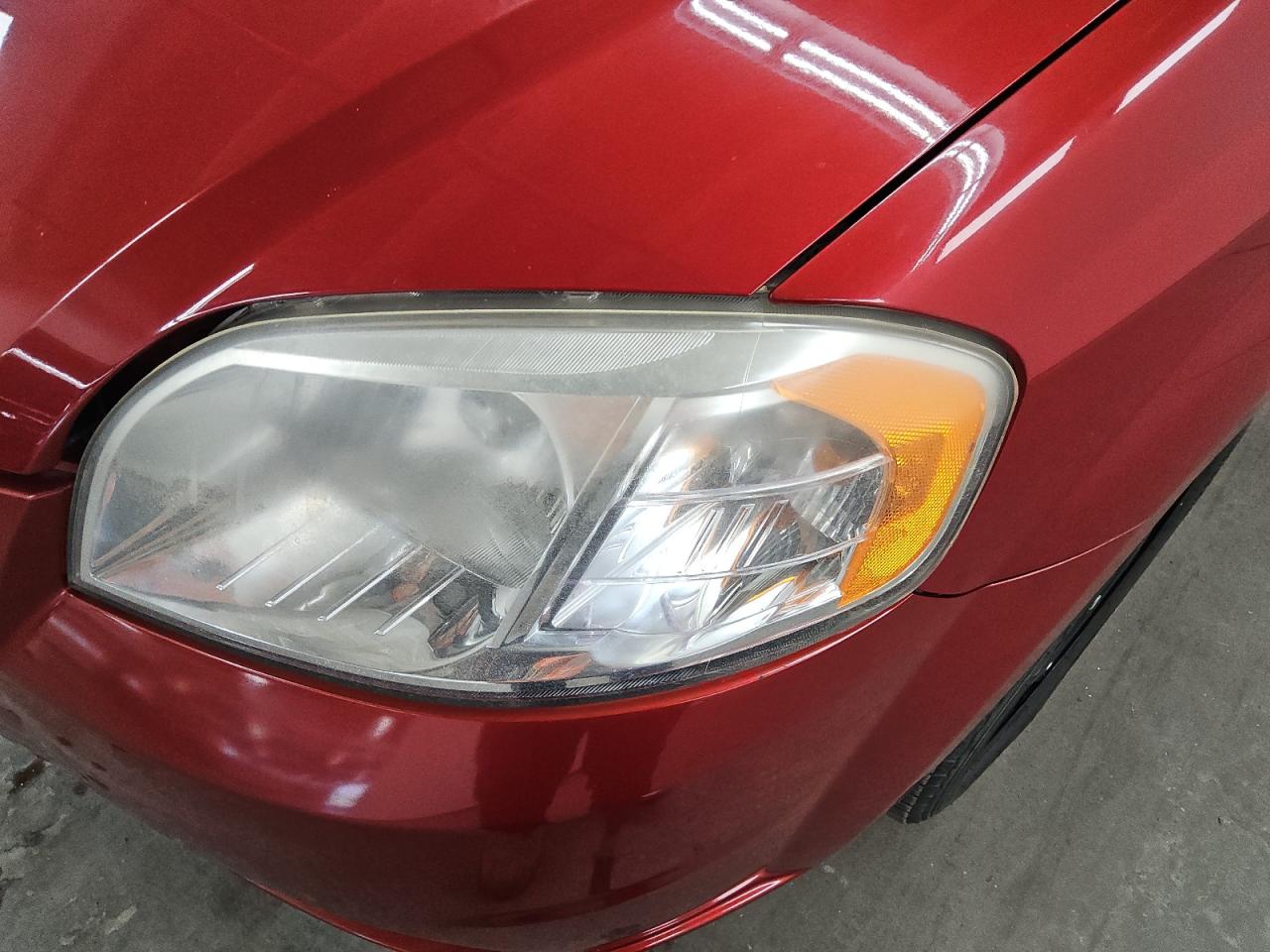 2011 Chevrolet Aveo Red vin: KL1TD5DE9BB220532 Damage: Left Head Lamp, Faded, Repair Required