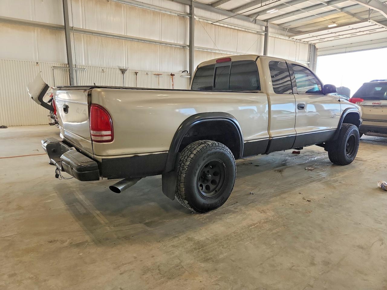 2002 Dodge Dakota Base Tan vin: 1B7GG12X32S701021
