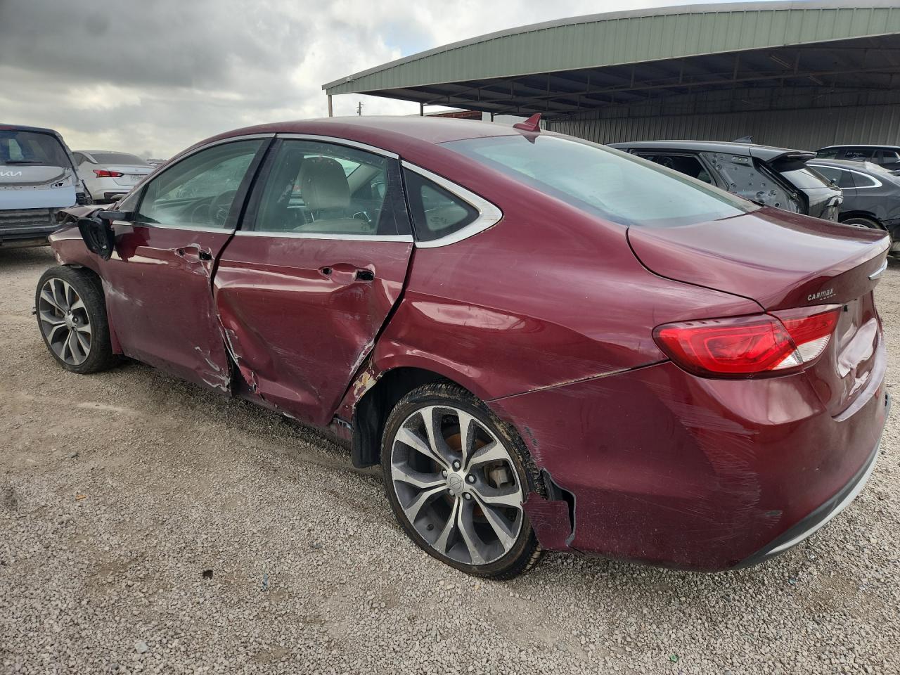 2015 Chrysler 200 C Maroon vin: 1C3CCCCB3FN527713 Damage: Left Rocker Panel, Dent(S) W/ Paint Dmg, > 12 Inches