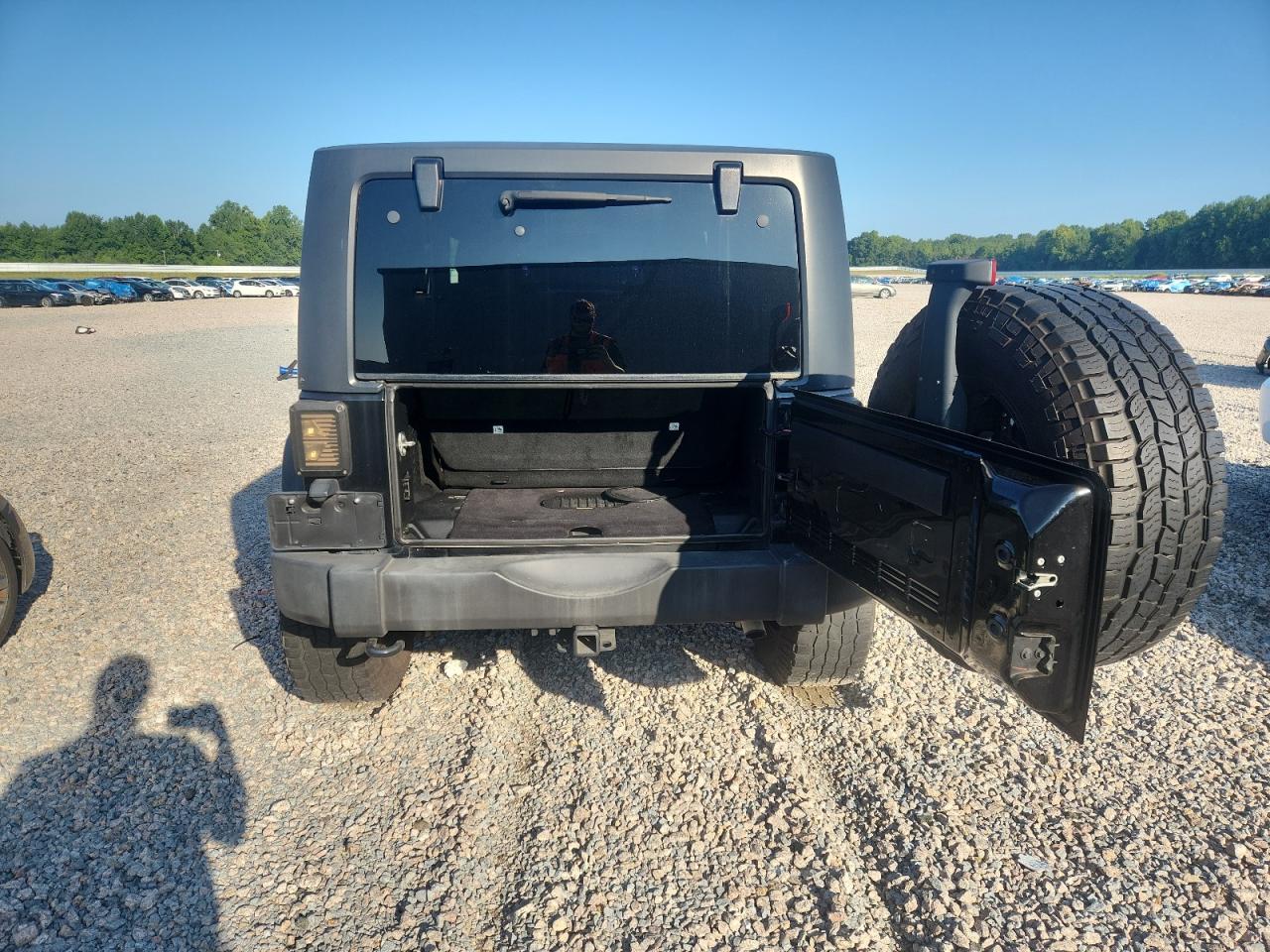 2015 Jeep Wrangler Sport Black vin: 1C4AJWAG1FL740731 Damage: Left Tail Light, Aftermarket, Acceptable