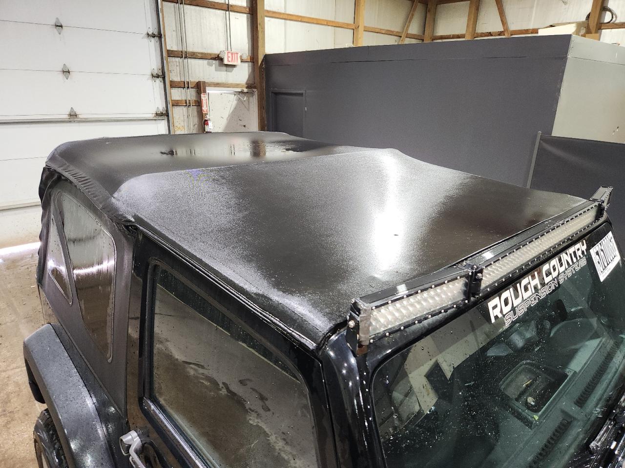 2015 Jeep Wrangler Sport Black vin: 1C4AJWAG7FL645493 Damage: Convertible Top, Aftermarket, Acceptable
