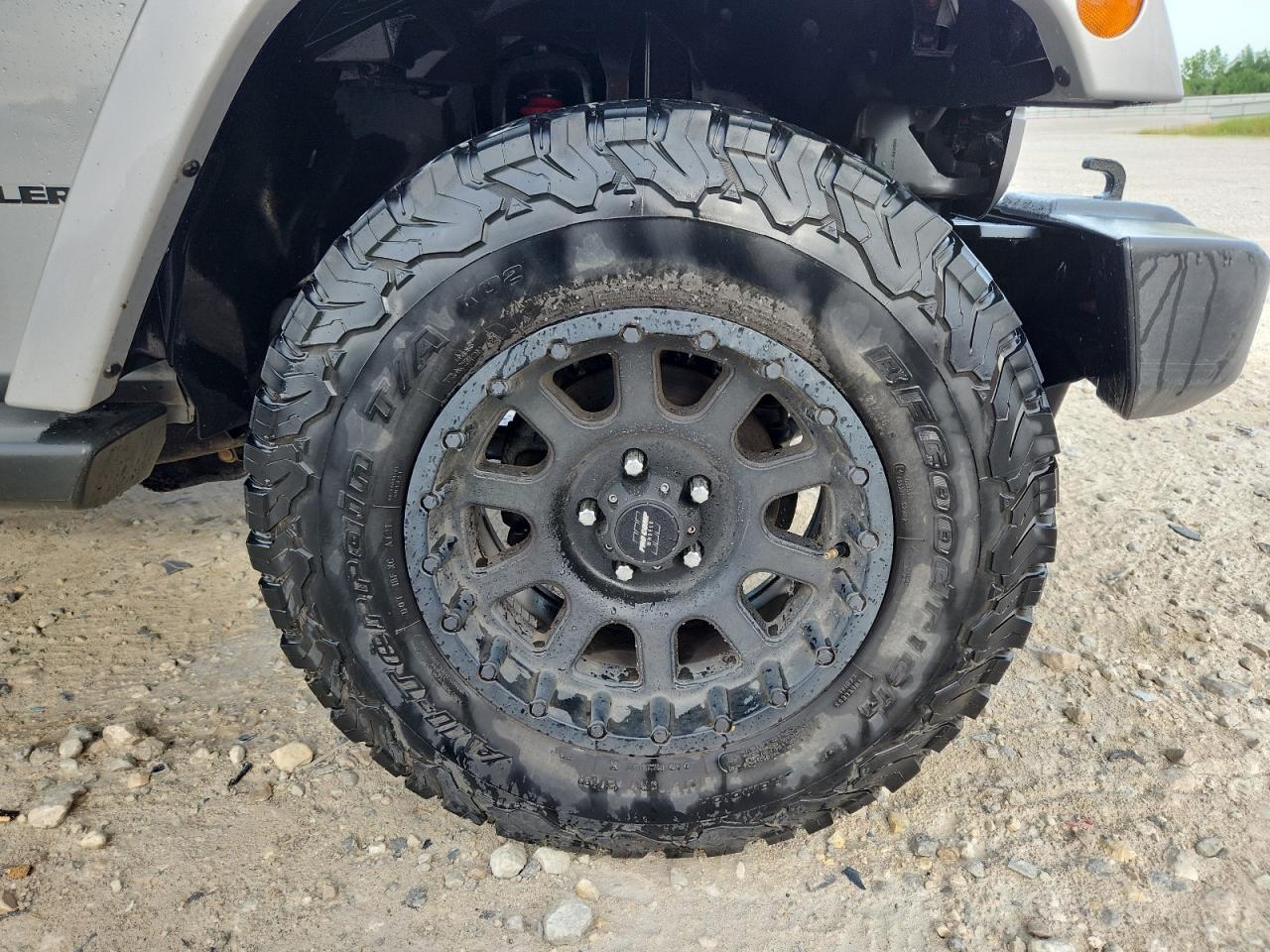 2015 Jeep Wrangler Sahara Silver vin: 1C4AJWBG3FL511546 Damage: Right Front Wheel, Aftermarket, Acceptable