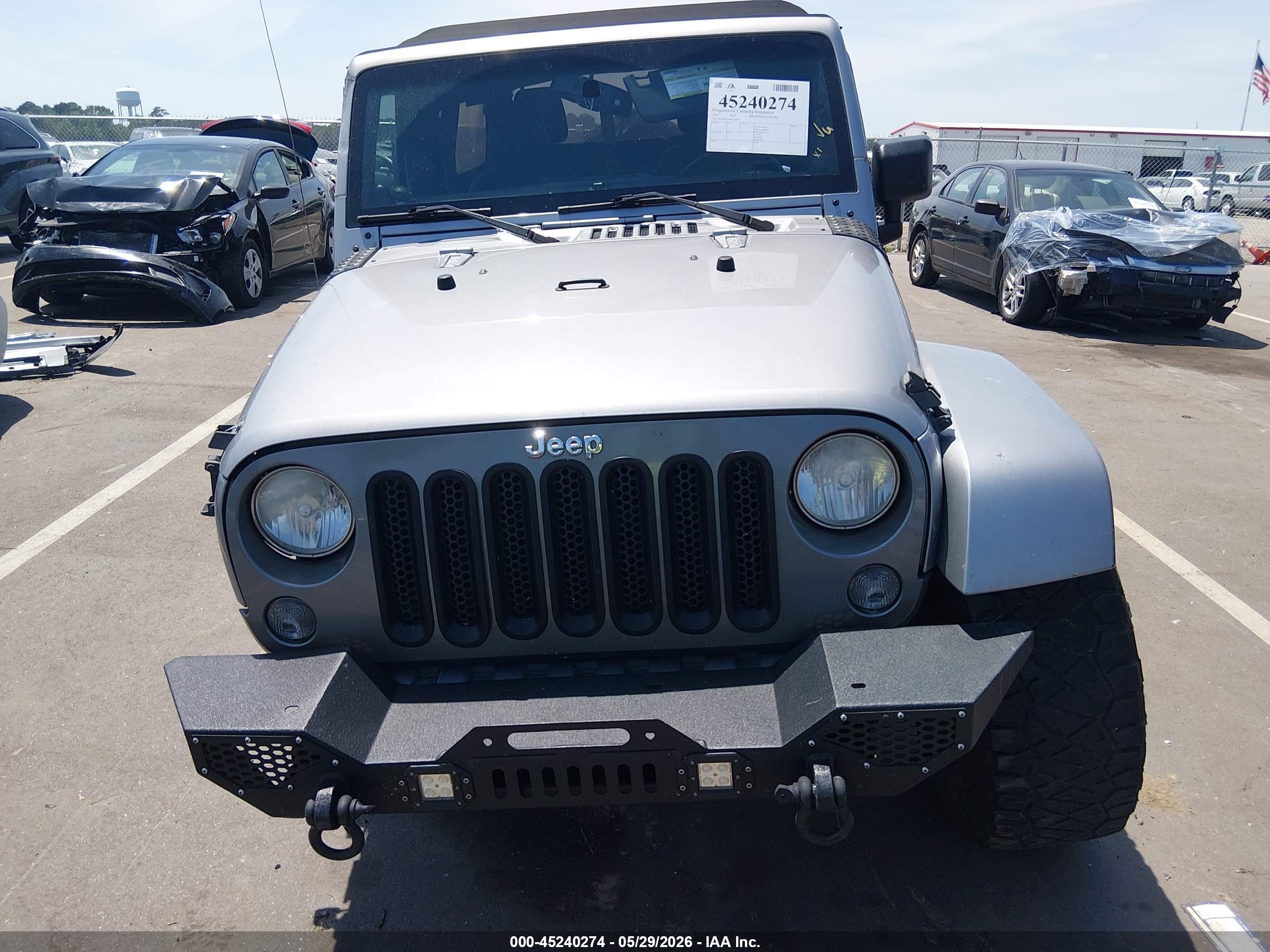 2014 Jeep Wrangler Unlimited Freedom Edition Silver vin: 1C4BJWDG0EL233379