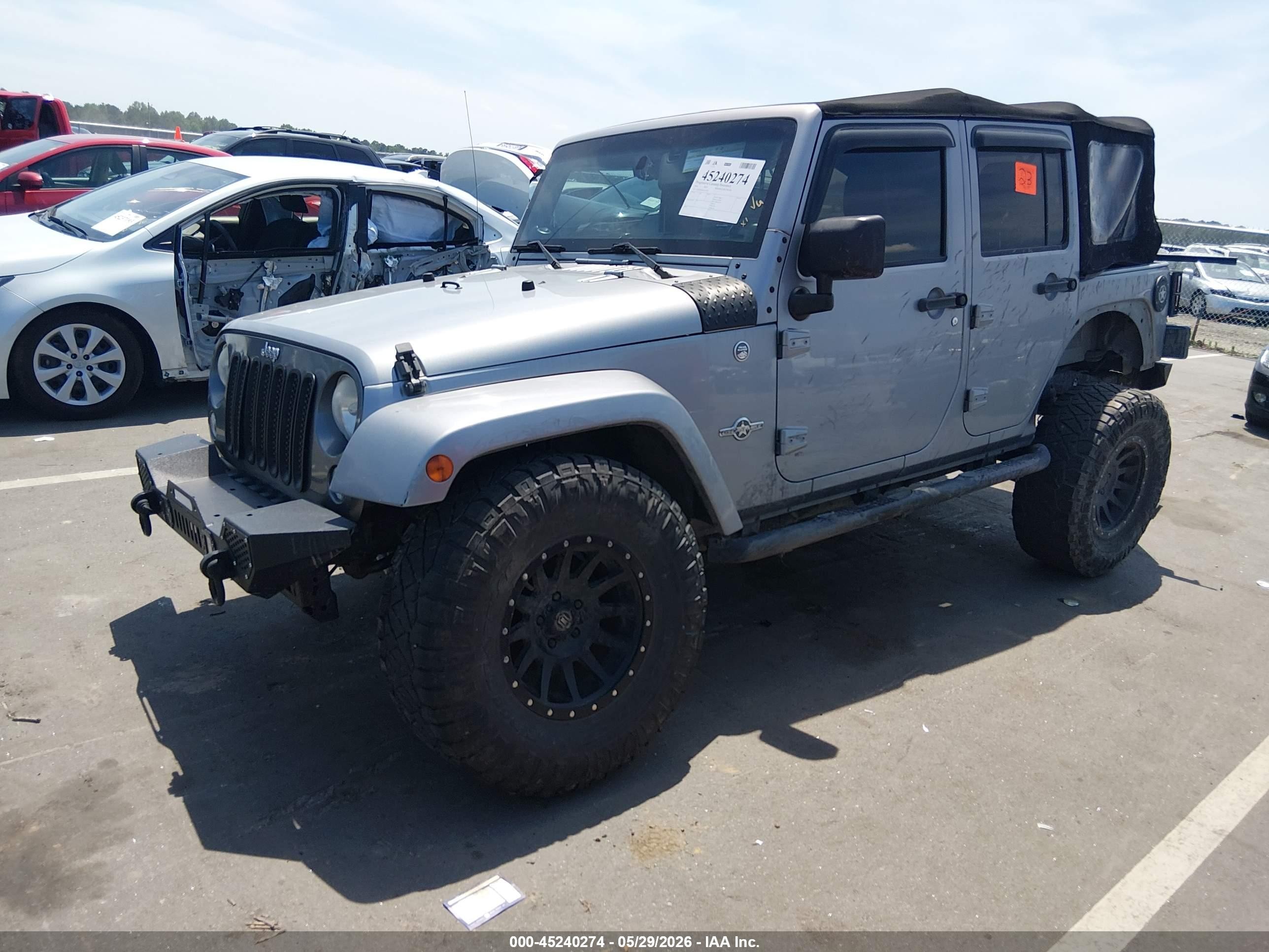 2014 Jeep Wrangler Unlimited Freedom Edition Silver vin: 1C4BJWDG0EL233379