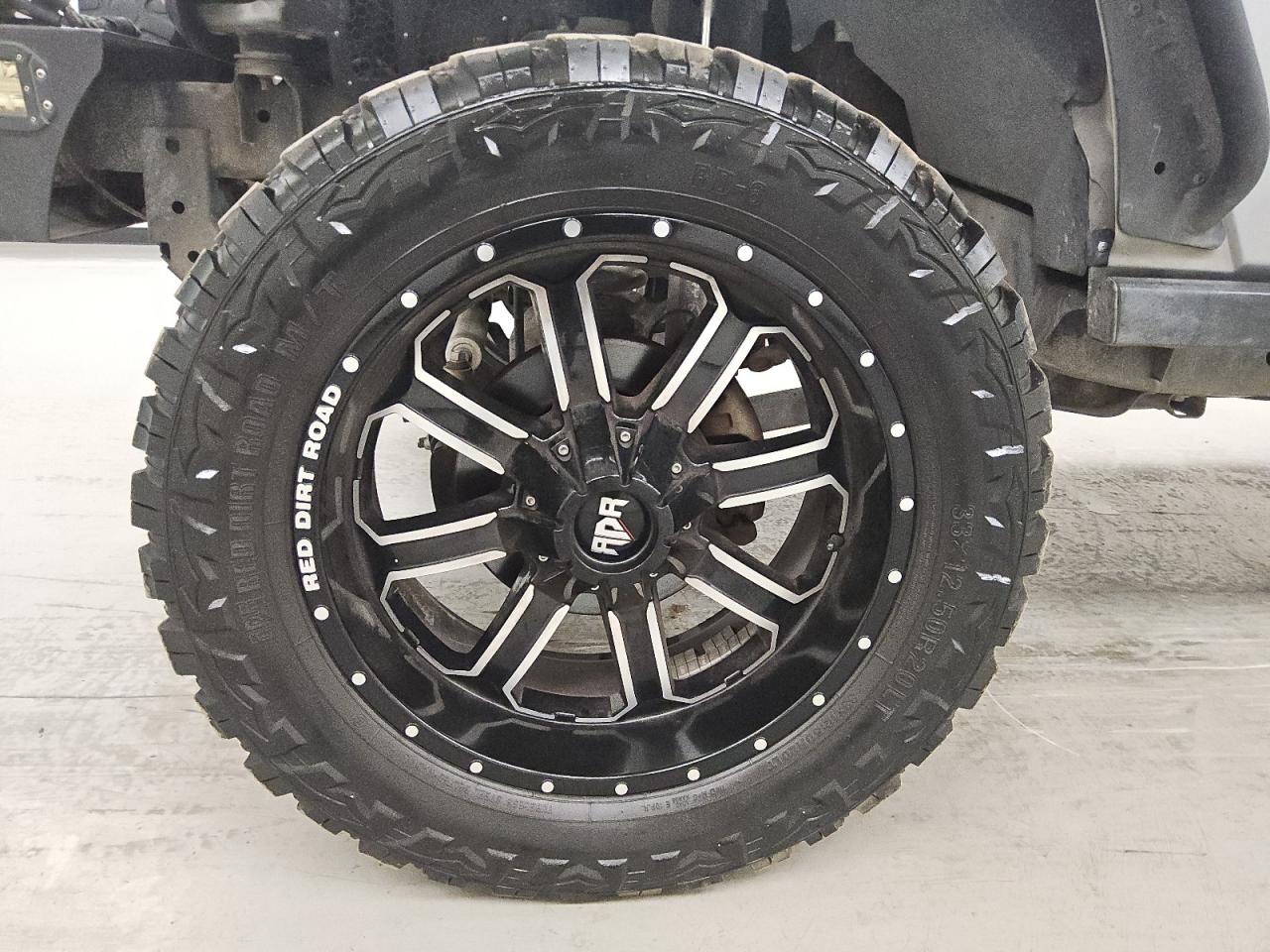 2015 Jeep Wrangler Unlimited Sport Silver vin: 1C4BJWDG5FL505104 Damage: Left Front Wheel, Aftermarket, Acceptable