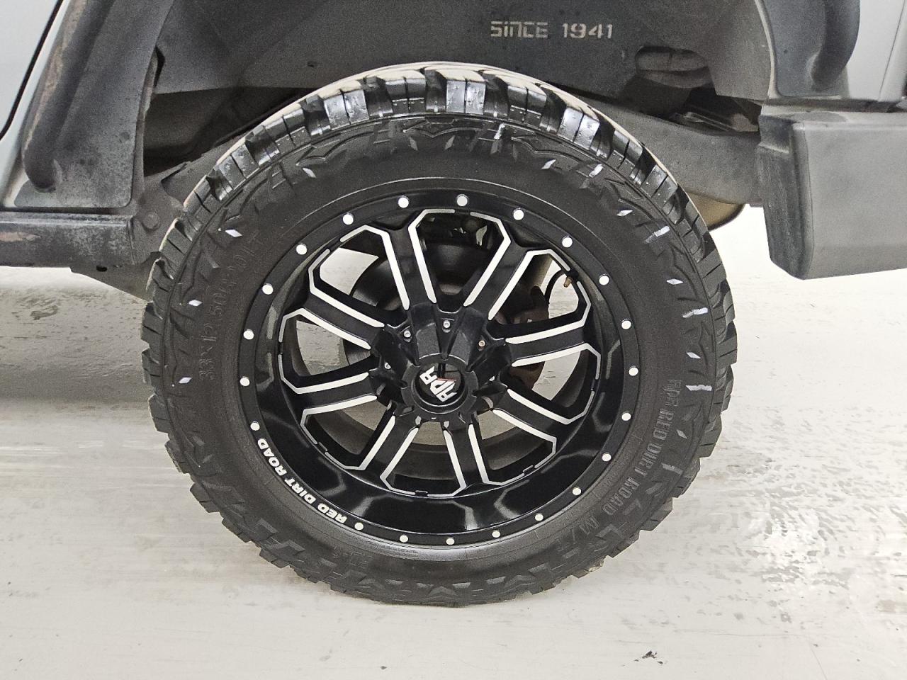 2015 Jeep Wrangler Unlimited Sport Silver vin: 1C4BJWDG5FL505104 Damage: Left Rear Wheel, Aftermarket, Acceptable