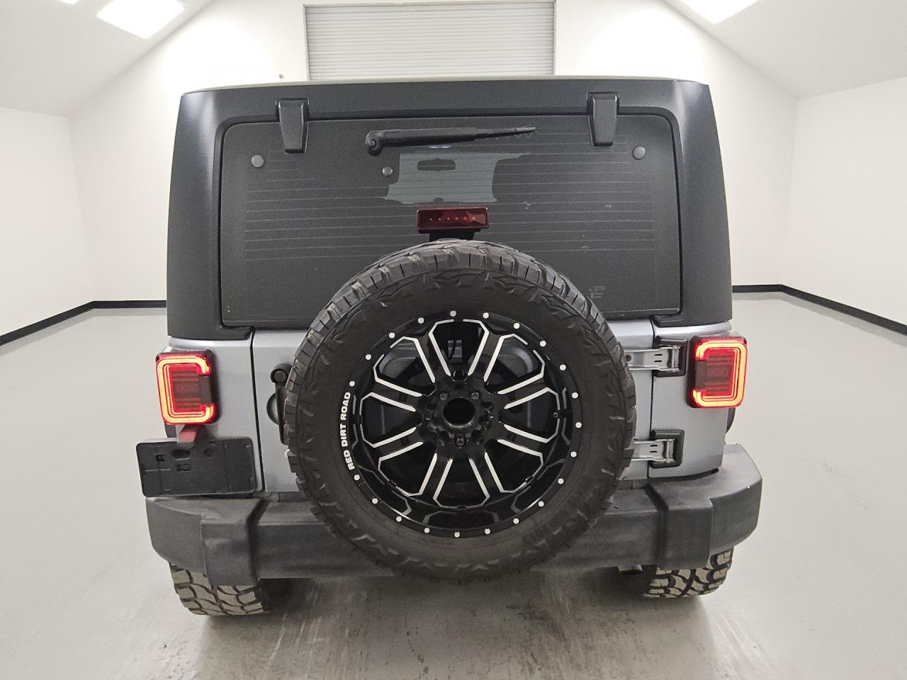 2015 Jeep Wrangler Unlimited Sport Silver vin: 1C4BJWDG5FL505104 Damage: Spare Wheel, Aftermarket, Acceptable