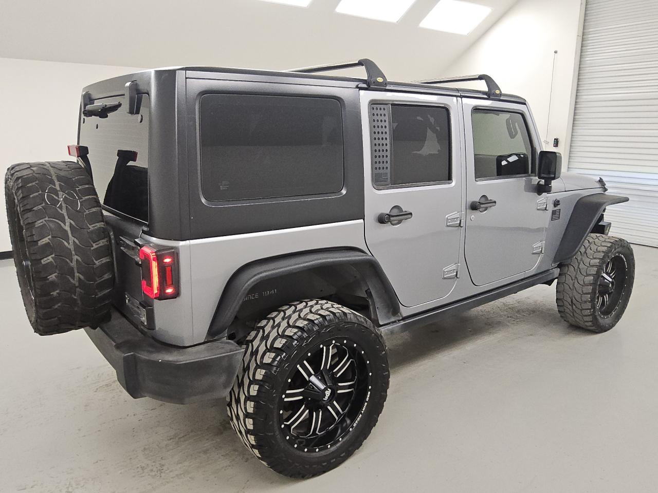 2015 Jeep Wrangler Unlimited Sport Silver vin: 1C4BJWDG5FL505104 Damage: Right Qtr Flare, Aftermarket, Acceptable