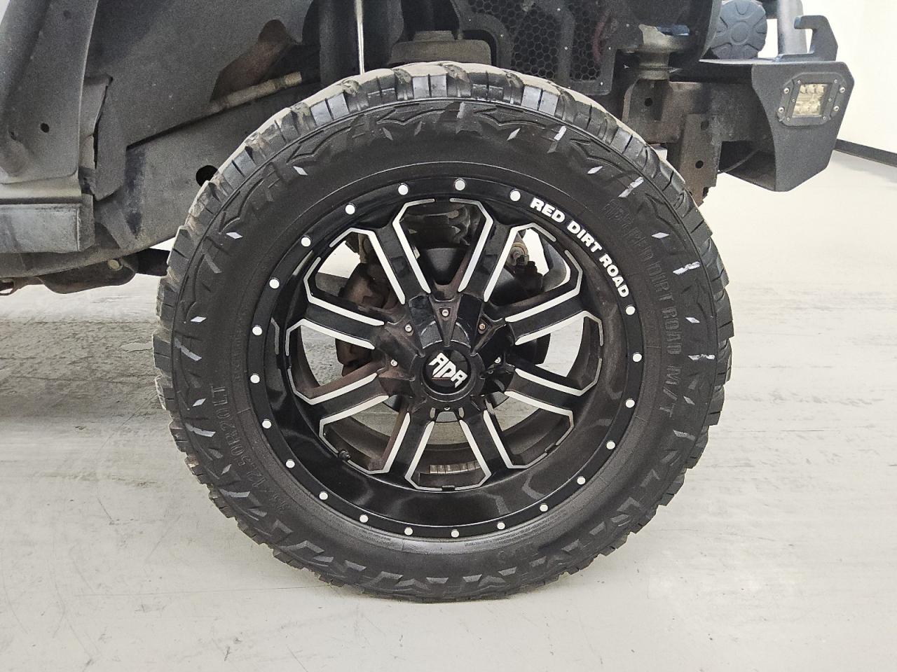 2015 Jeep Wrangler Unlimited Sport Silver vin: 1C4BJWDG5FL505104 Damage: Right Front Wheel, Aftermarket, Acceptable