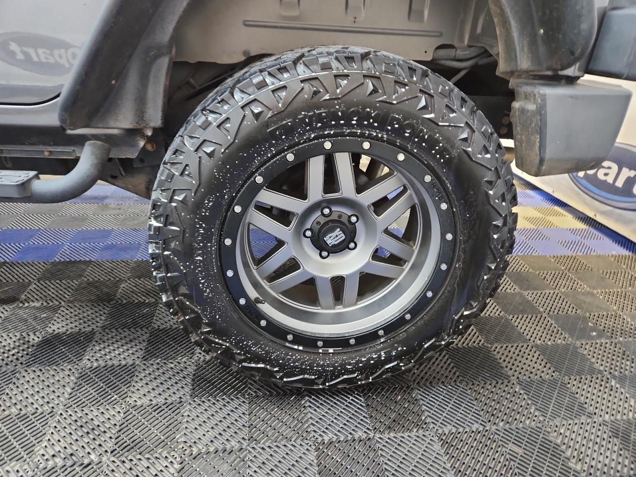 2014 Jeep Wrangler Unlimited Sport Gray vin: 1C4BJWDG6EL270288 Damage: Left Rear Wheel, Aftermarket, Acceptable