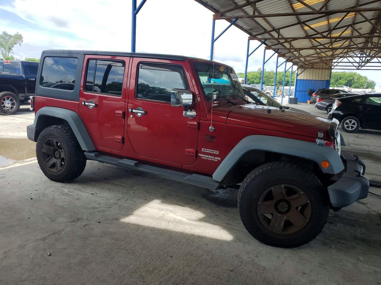 2012 Jeep Wrangler Unlimited Sport Burgundy vin: 1C4BJWDG9CL184177