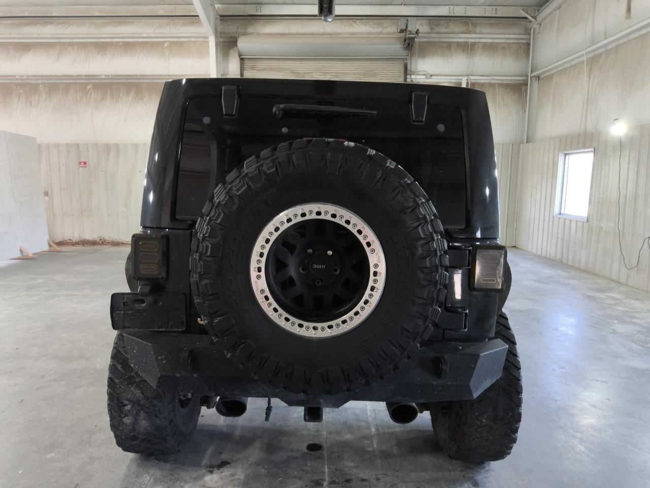 2014 Jeep Wrangler Unlimited Sahara Black vin: 1C4BJWEG0EL190211 Damage: Right Tail Light, Aftermarket, Acceptable