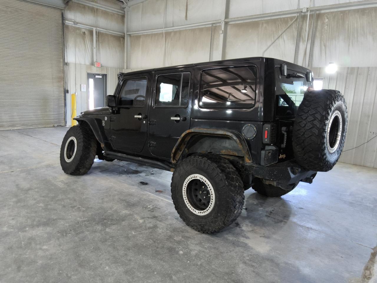 2014 Jeep Wrangler Unlimited Sahara Black vin: 1C4BJWEG0EL190211 Damage: Left Qtr Panel, Corrosion, > 12 Inches
