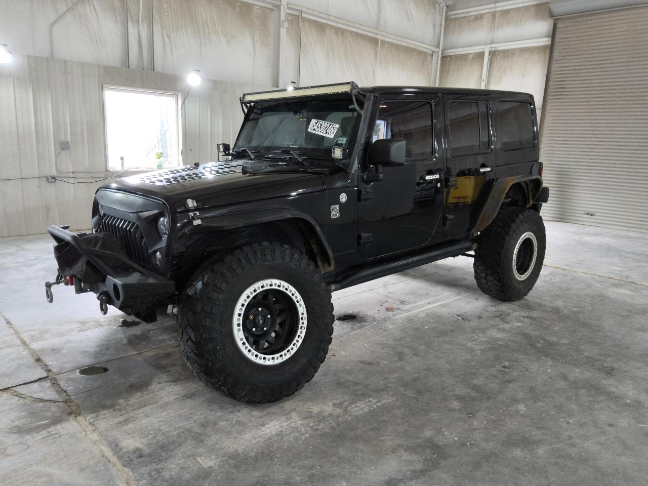 2014 Jeep Wrangler Unlimited Sahara Black vin: 1C4BJWEG0EL190211 Damage: Left Front Wheel, Aftermarket, Acceptable