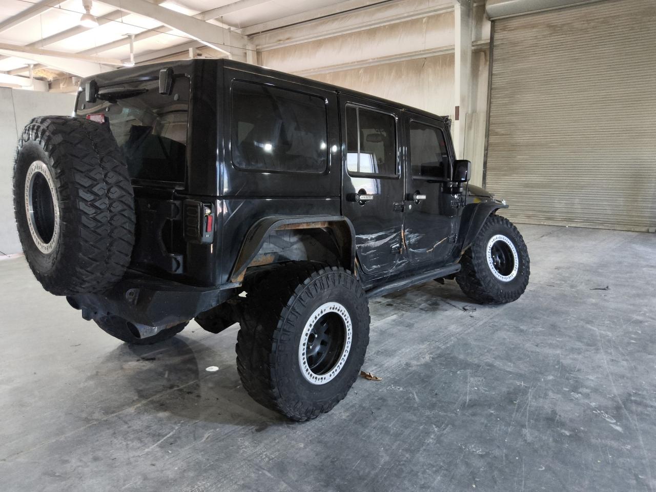 2014 Jeep Wrangler Unlimited Sahara Black vin: 1C4BJWEG0EL190211 Damage: Right Rear Wheel, Aftermarket, Acceptable