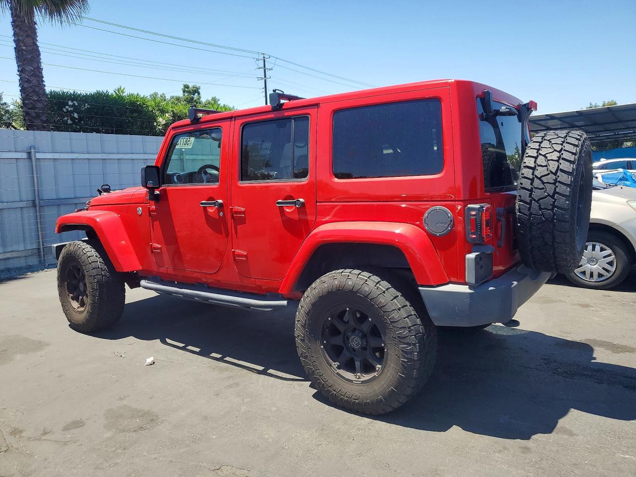 2015 Jeep Wrangler Unlimited Sahara Red vin: 1C4BJWEG2FL600458