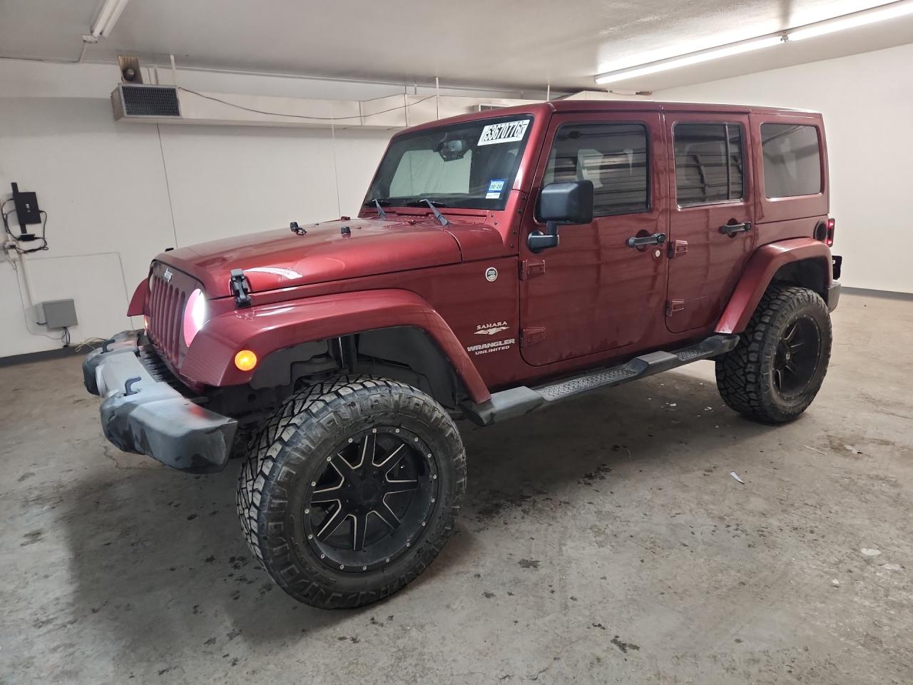 2013 Jeep Wrangler Unlimited Sahara Burgundy vin: 1C4BJWEG7DL503365 Damage: Left Front Wheel, Aftermarket, Replacement Required