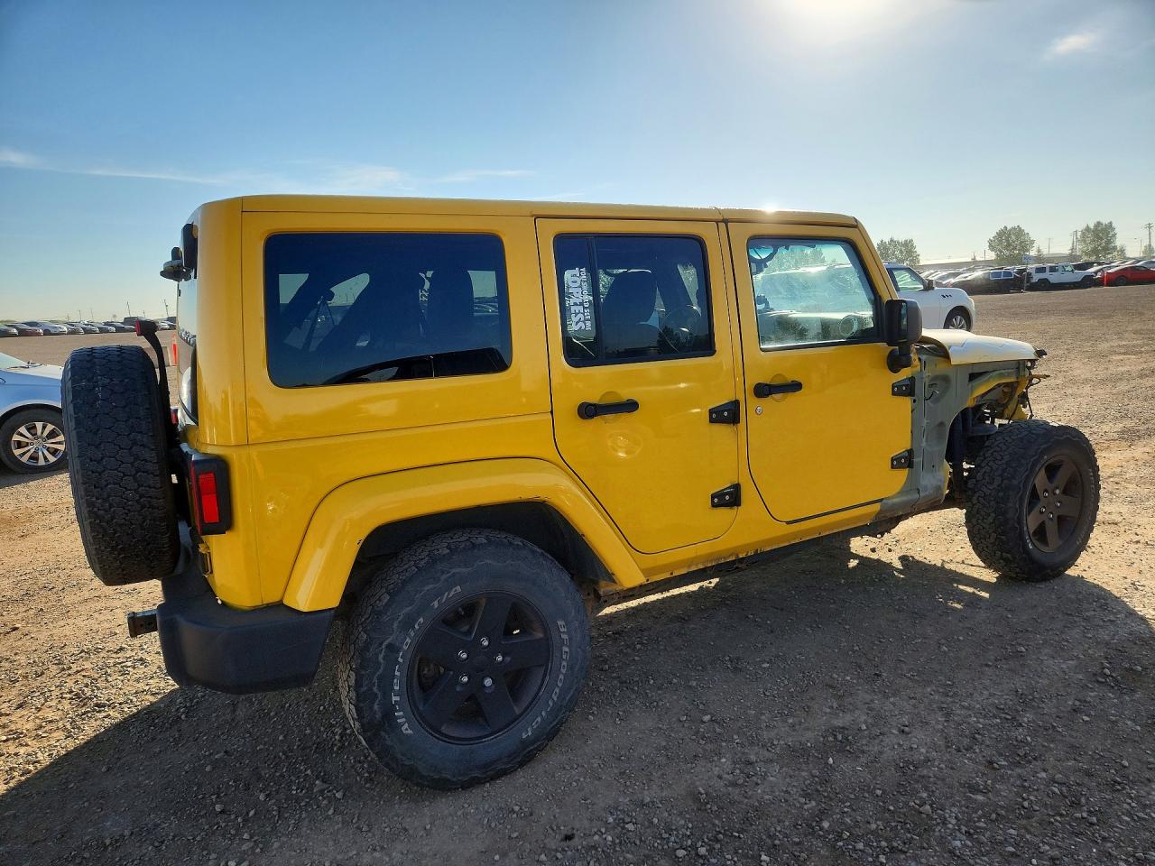 2015 Jeep Wrangler Unlimited Sahara Yellow vin: 1C4BJWEG7FL615540