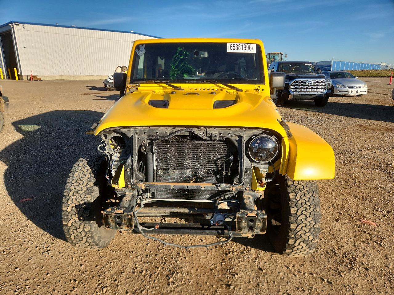 2015 Jeep Wrangler Unlimited Sahara Yellow vin: 1C4BJWEG7FL615540