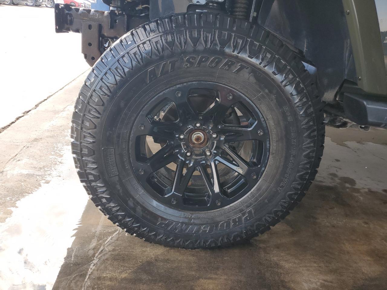 2015 Jeep Wrangler Unlimited Sahara Brown vin: 1C4BJWEG9FL723142 Damage: Left Front Wheel, Aftermarket, Acceptable