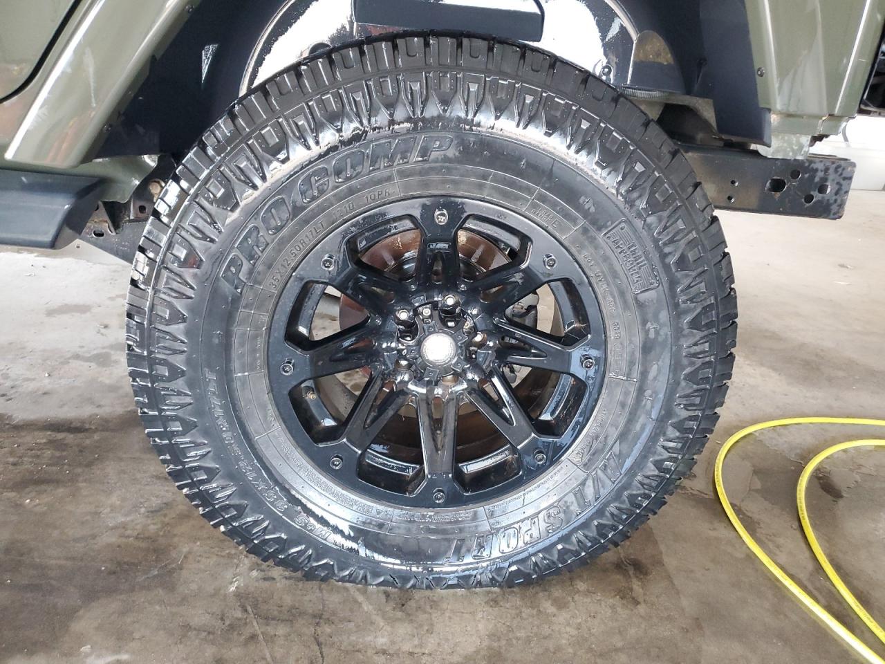 2015 Jeep Wrangler Unlimited Sahara Brown vin: 1C4BJWEG9FL723142 Damage: Left Rear Wheel, Aftermarket, Acceptable