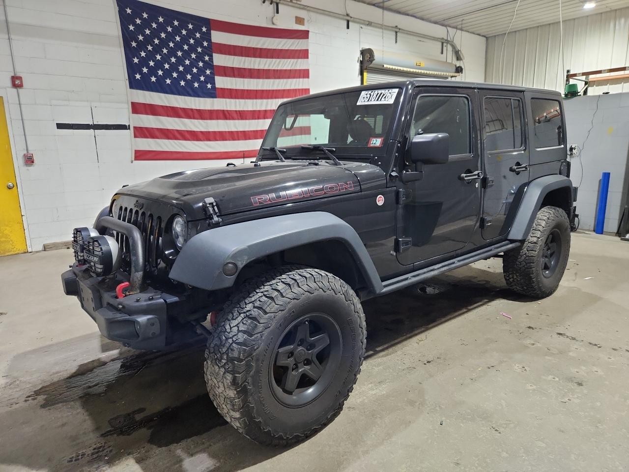 2015 Jeep Wrangler Unlimited Rubicon Black vin: 1C4BJWFG4FL725086 Damage: Left Front Wheel, Aftermarket, Acceptable