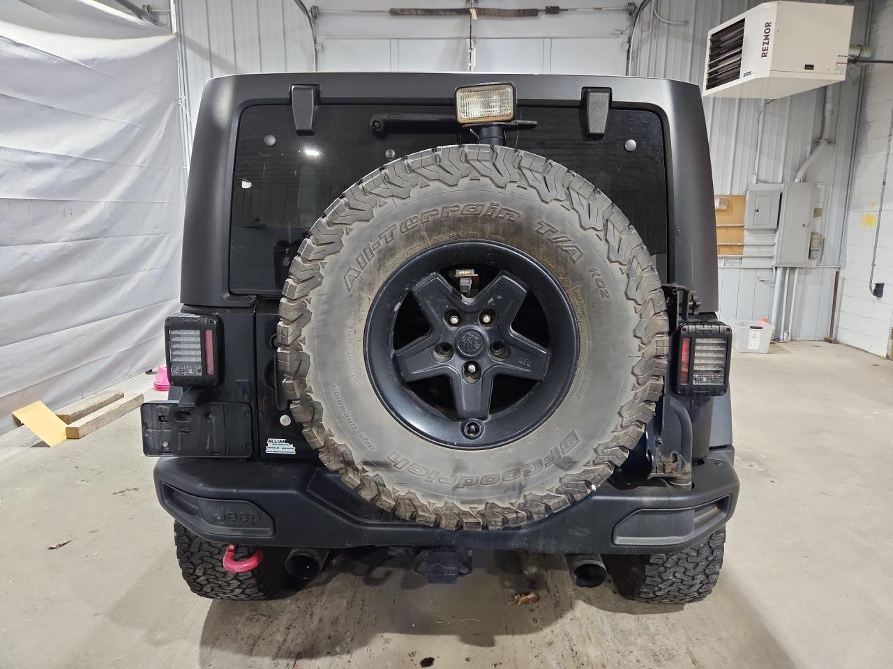 2015 Jeep Wrangler Unlimited Rubicon Black vin: 1C4BJWFG4FL725086 Damage: Right Tail Light, Aftermarket, Acceptable