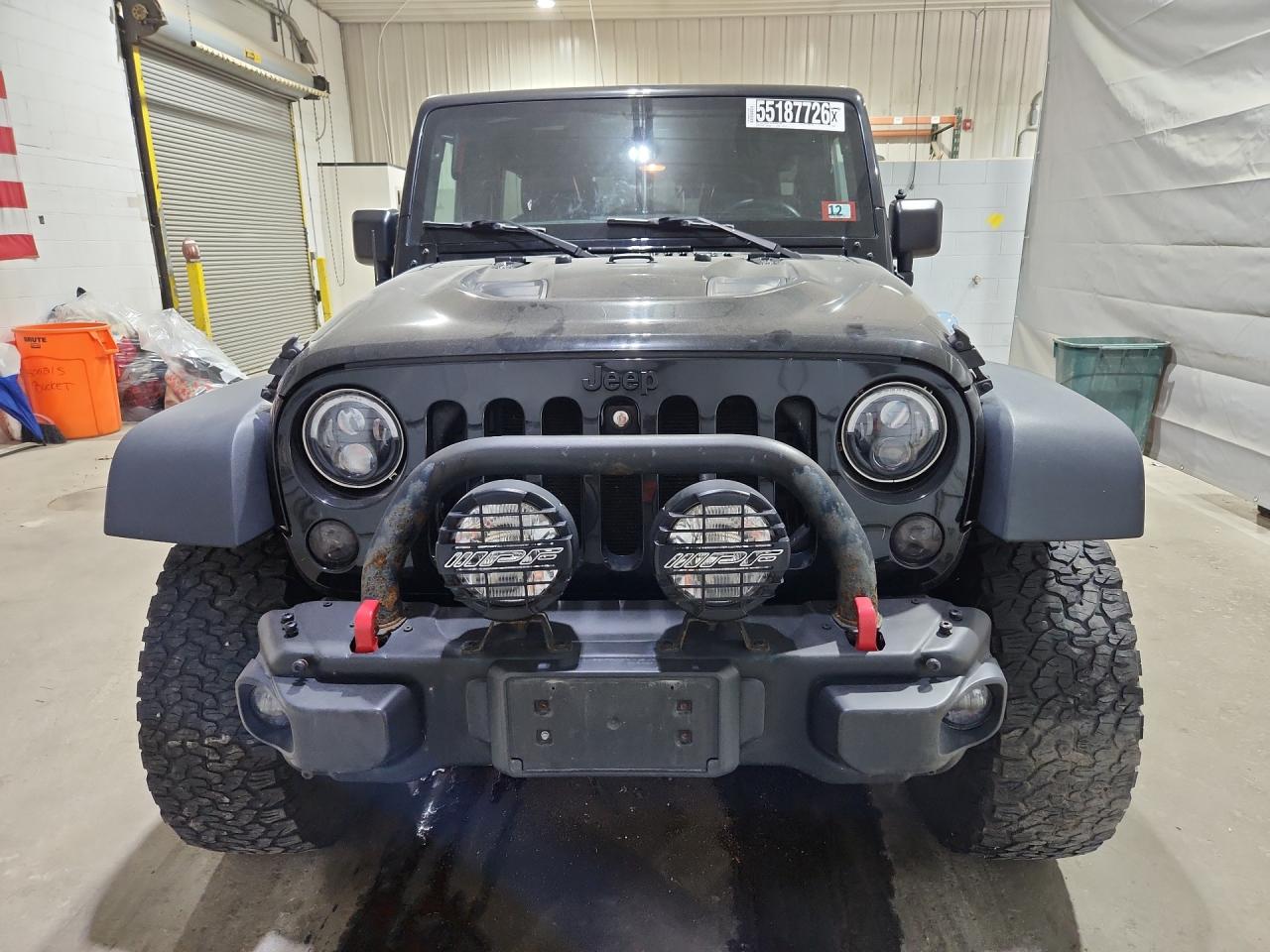 2015 Jeep Wrangler Unlimited Rubicon Black vin: 1C4BJWFG4FL725086 Damage: Front Bumper, Aftermarket, Acceptable