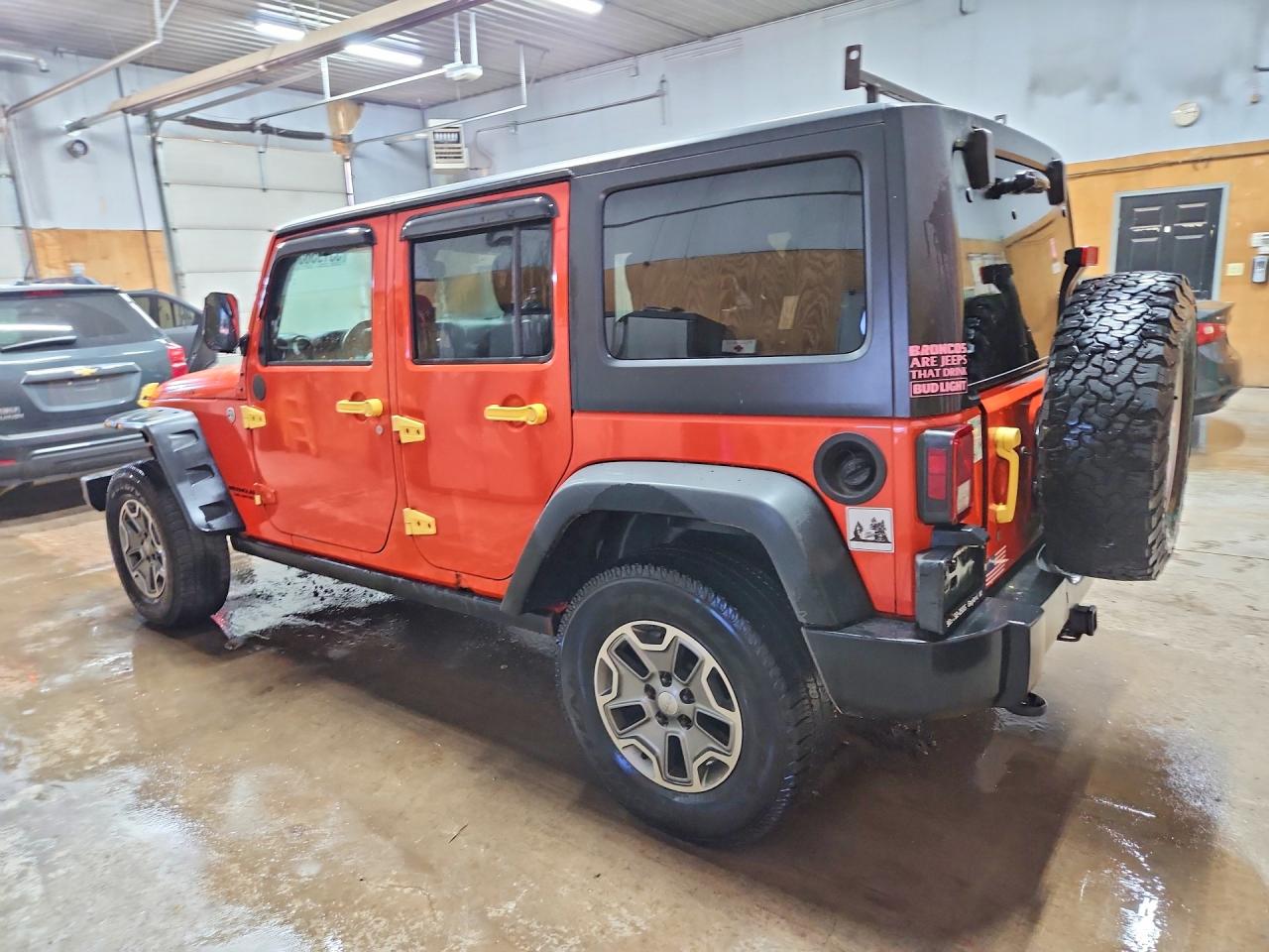 2015 Jeep Wrangler Unlimited Rubicon Orange vin: 1C4BJWFG9FL697916