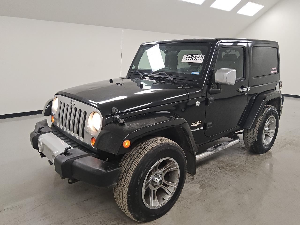 2012 Jeep Wrangler Sahara Black vin: 1C4GJWBG8CL169730 Damage: Gas Cap, Leak, Repair Required