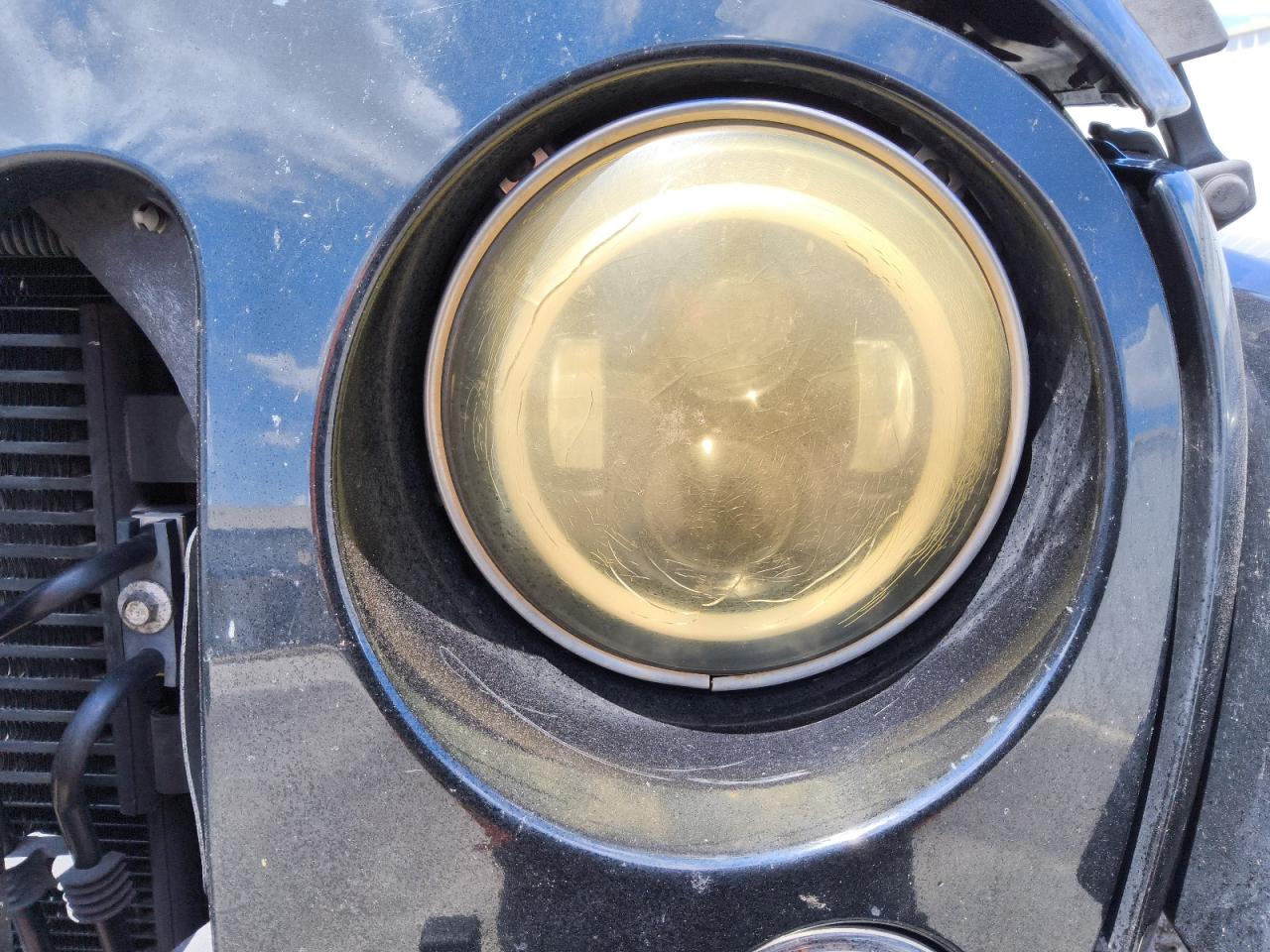 2015 Jeep Wrangler Unlimited Sahara Black vin: 1C4HJWEG3FL500508 Damage: Left Head Lamp, Cracked, Replacement Required