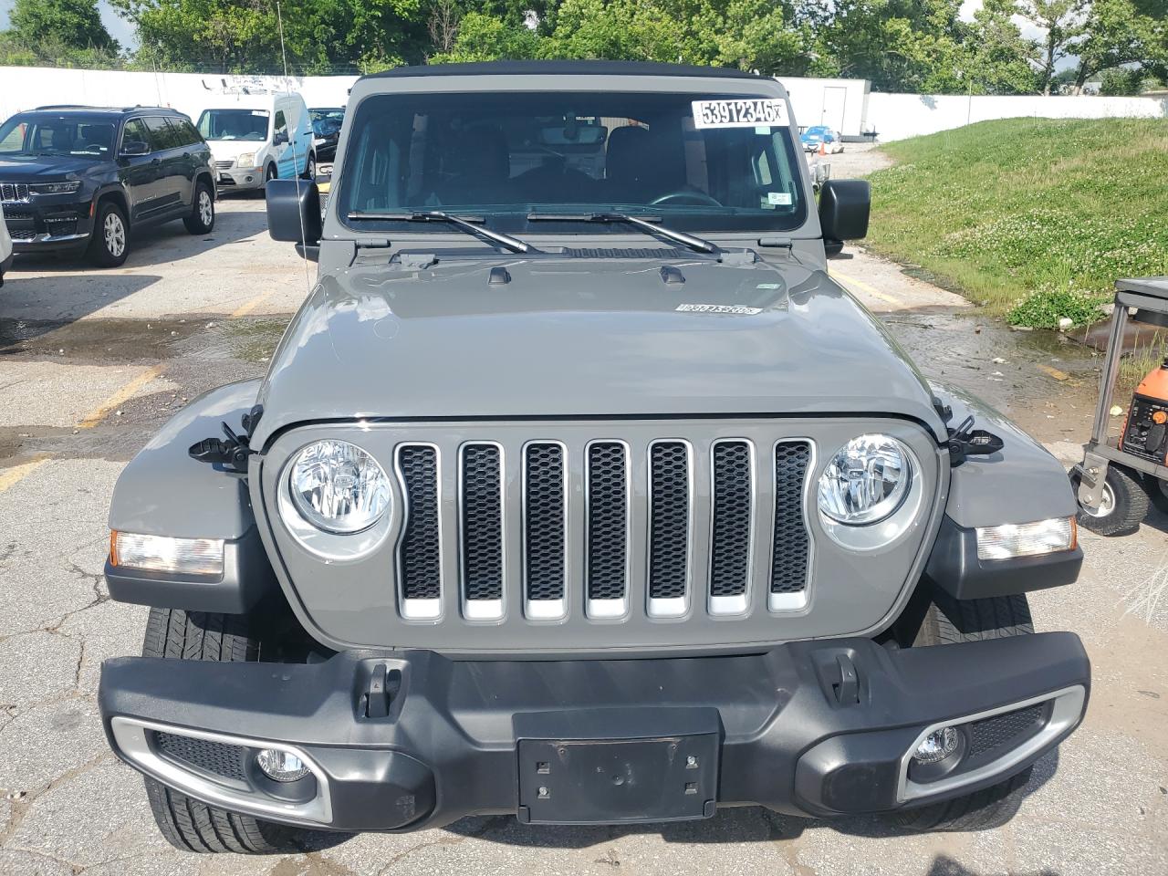 2023 Jeep Wrangler Sahara Silver vin: 1C4HJXEN0PW677098 Damage: Front Bumper, Gouged, 3 To 4 Inches