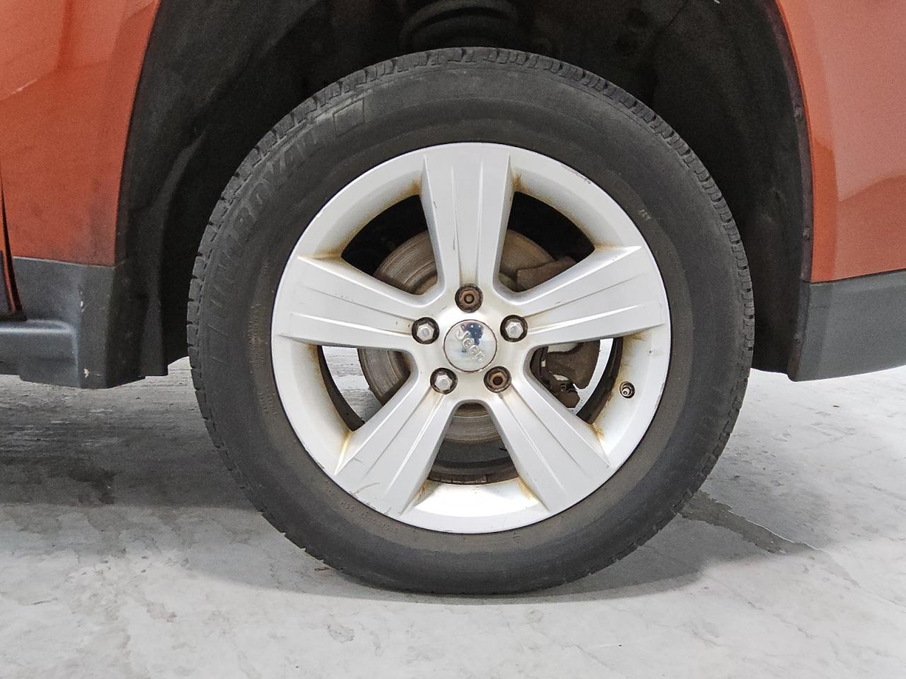 2012 Jeep Compass Sport Orange vin: 1C4NJCBA8CD605892 Damage: Right Front Wheel, Curb Rash, 4 To 5 Inches