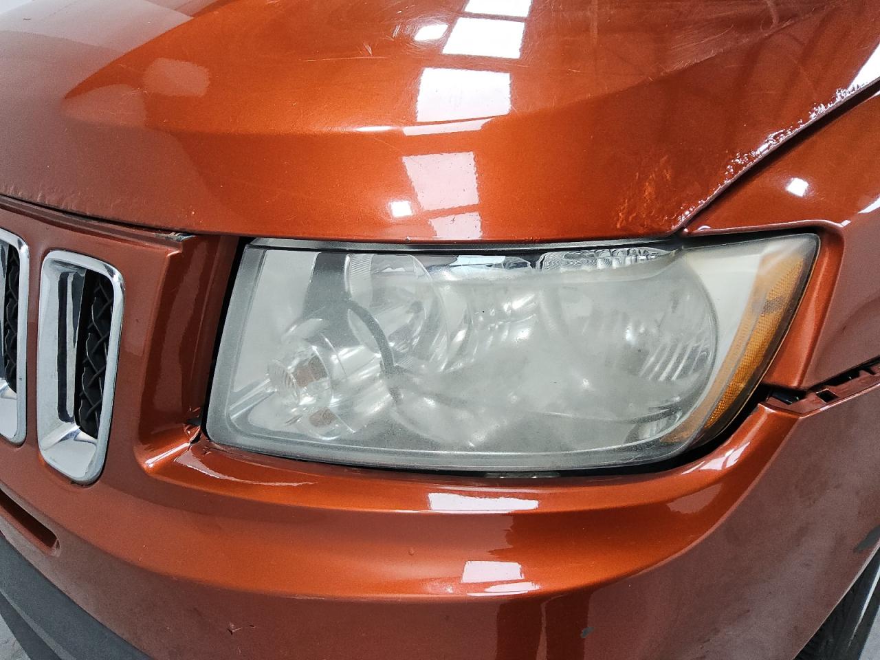 2012 Jeep Compass Sport Orange vin: 1C4NJCBA8CD605892 Damage: Left Head Lamp, Faded, Repair Required