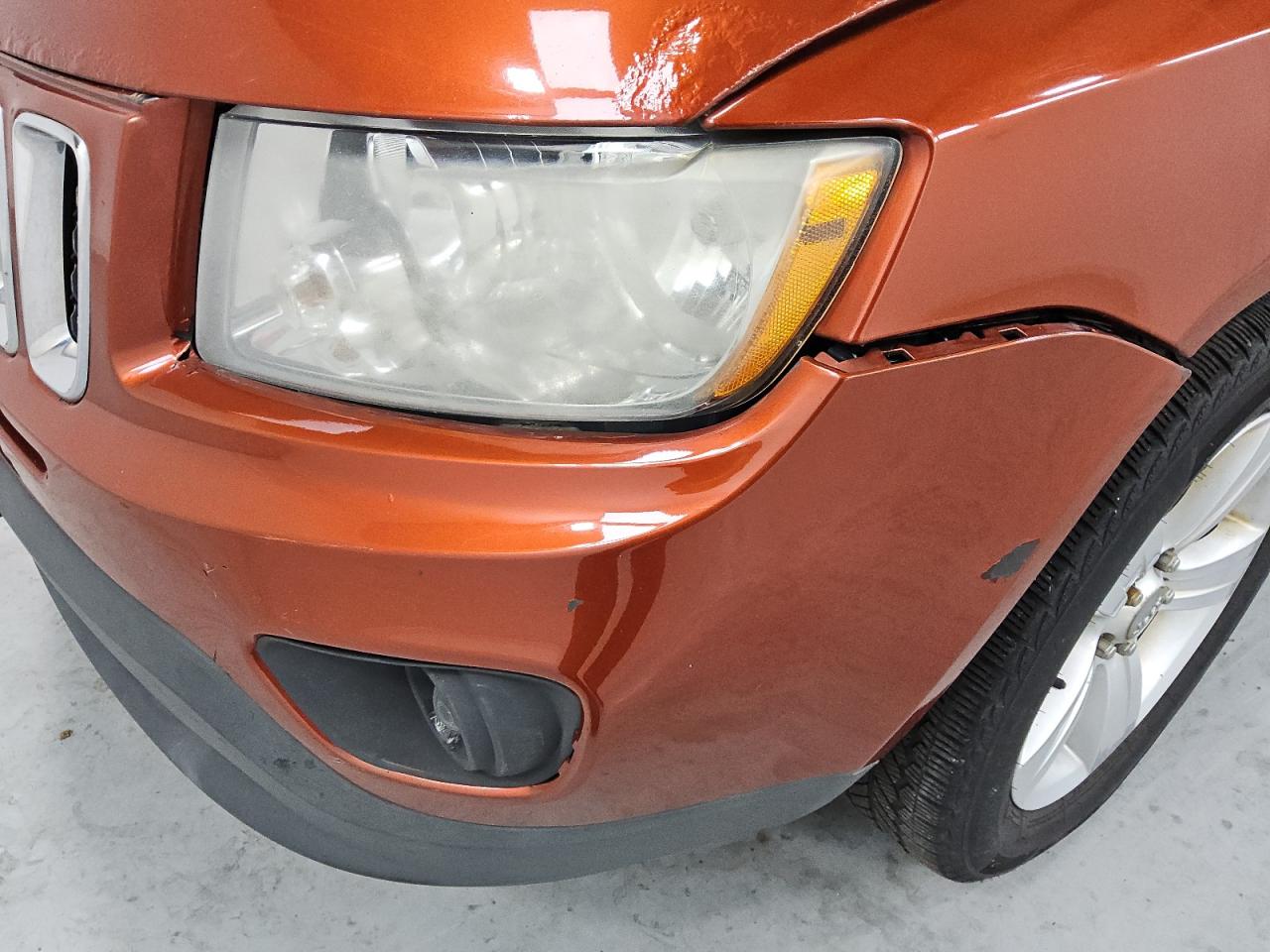 2012 Jeep Compass Sport Orange vin: 1C4NJCBA8CD605892 Damage: Front Bumper, Broken, Replacement Required