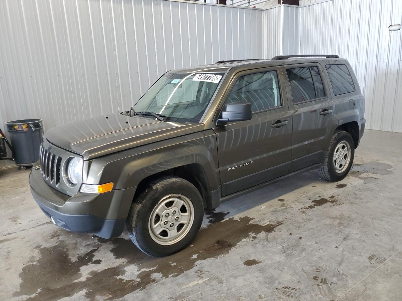 2015 Jeep Partroit Green vin: 1C4NJPBB3FD414093 Damage: Left Front Fender, Dent(S) W/ Paint Dmg, > 12 Inches