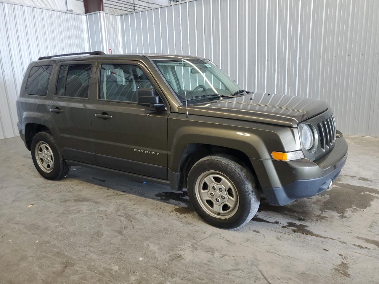 2015 Jeep Partroit Green vin: 1C4NJPBB3FD414093 Damage: Front Bumper Cover Lower, Heavy Scratch, < 1/8 Inch