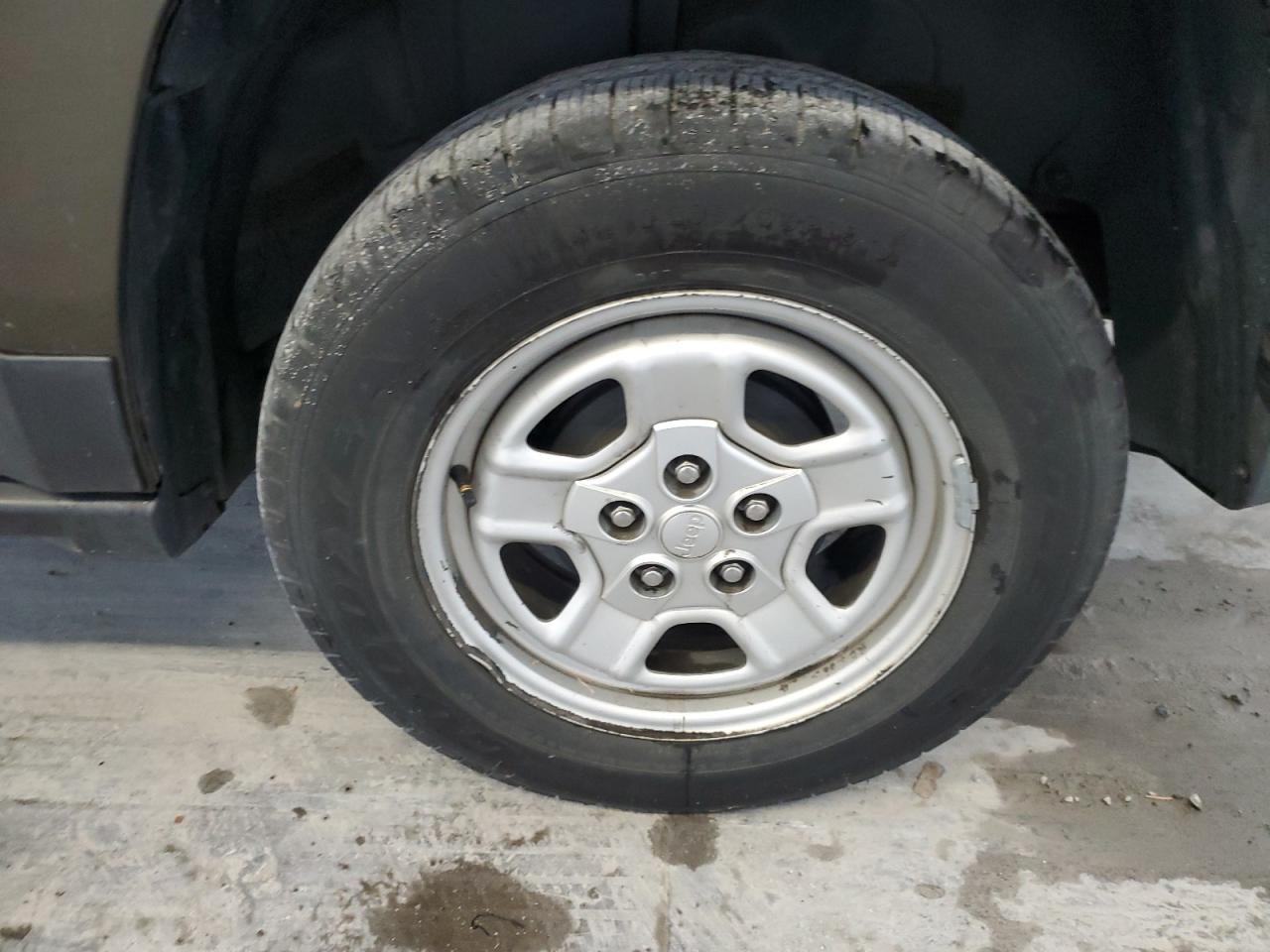 2015 Jeep Partroit Green vin: 1C4NJPBB3FD414093 Damage: Left Rear Wheel, Bent, Replacement Required