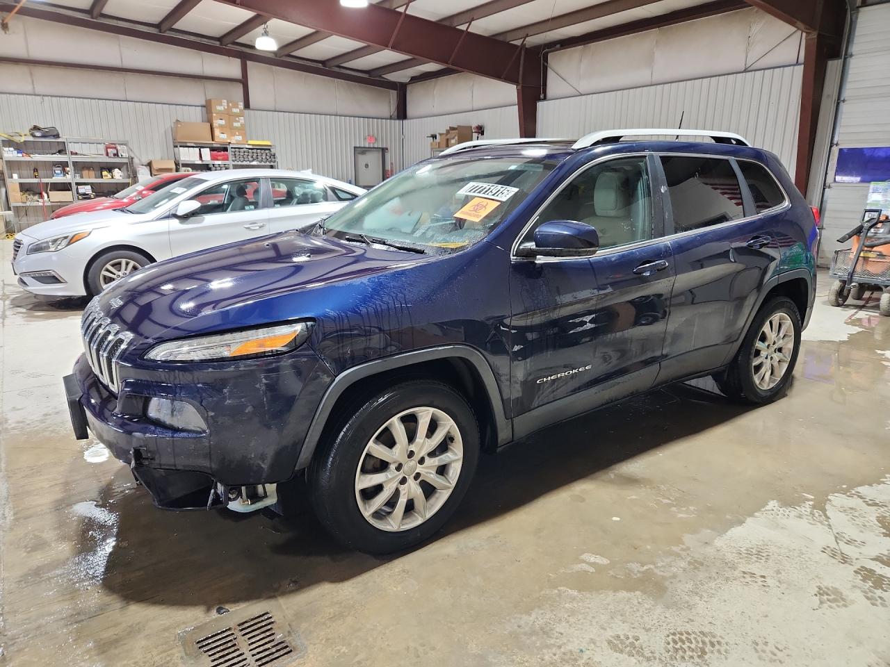 2016 Jeep Cherokee Limited Blue vin: 1C4PJMDB9GW259771 Damage: Left Front Fender, Dent(S) W/ Paint Dmg, 5 To 6 Inches