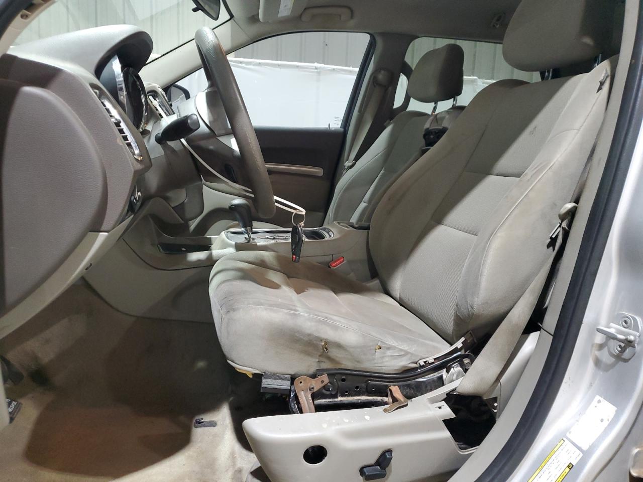 2012 Dodge Durango Sxt Silver vin: 1C4RDJAG4CC312435 Damage: Left Front Seat Cushion, Worn, Replacement Required