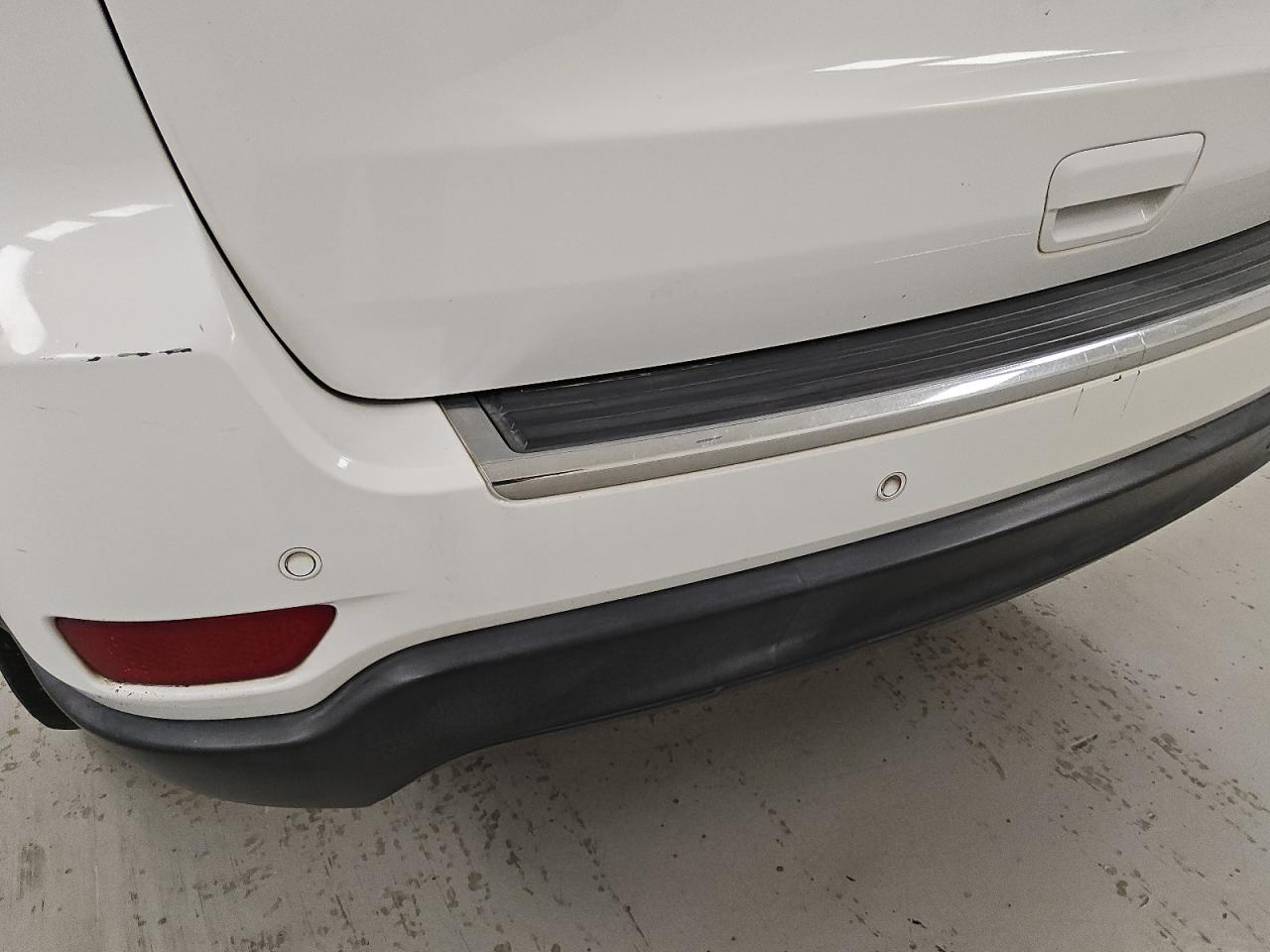 2015 Jeep Grand Cherokee Limited White vin: 1C4RJEBG0FC780181 Damage: Rear Bumper, Chipped, 10 Or More