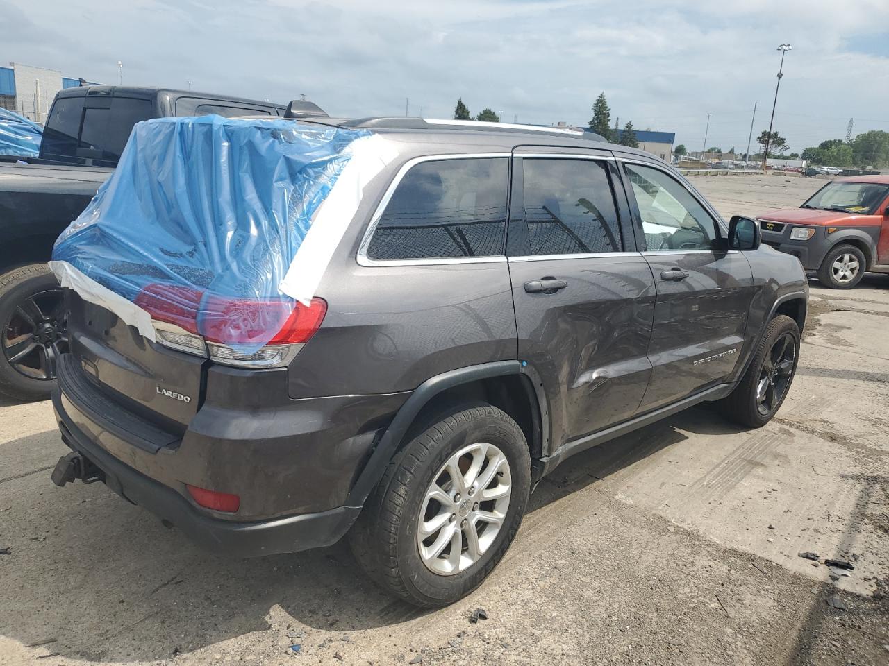 2015 Jeep Grand Cherokee Laredo Серый vin: 1C4RJFAG2FC671826