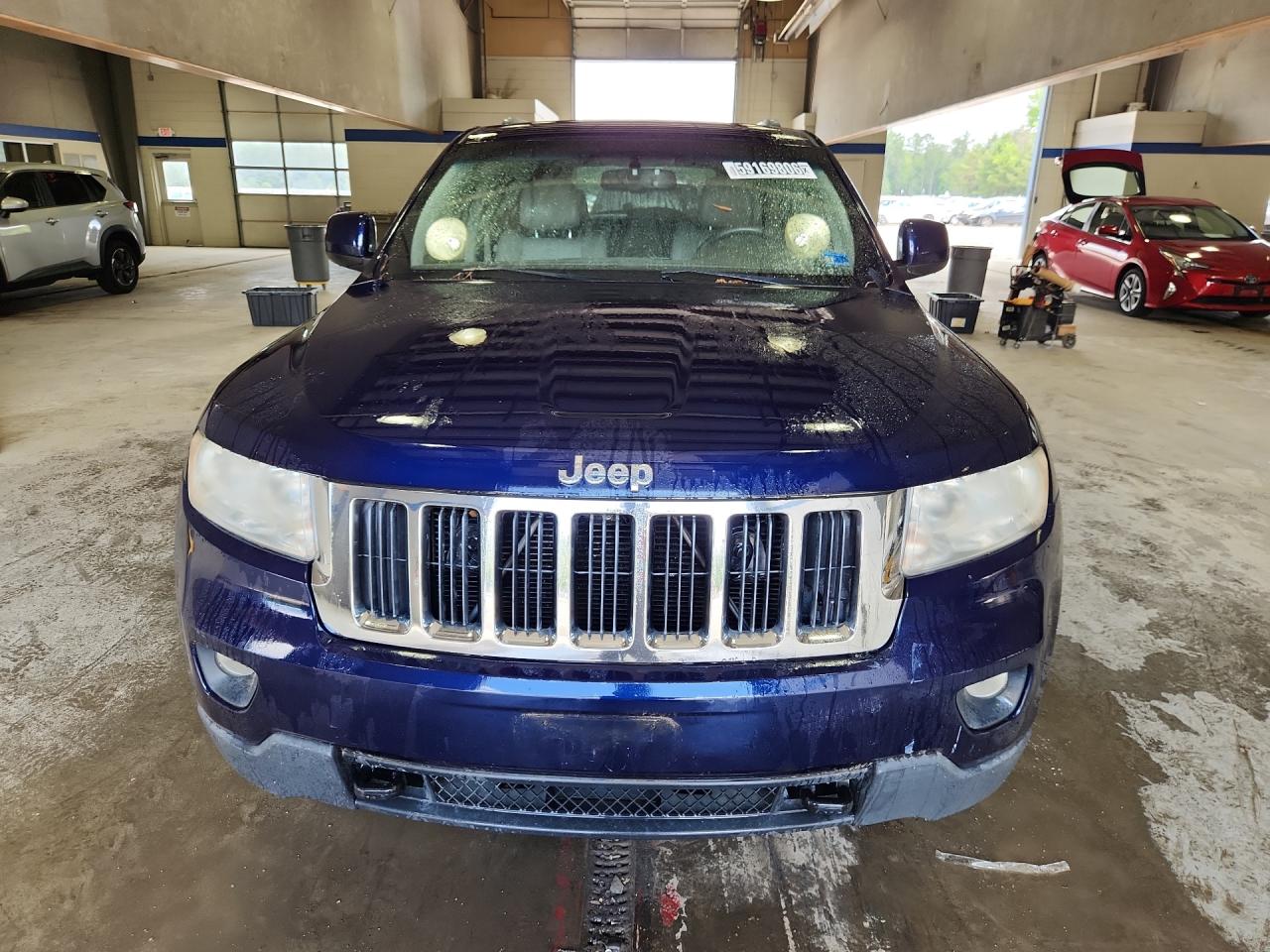 2012 Jeep Grand Cherokee Laredo Blue vin: 1C4RJFAG5CC285428 Damage: Left Head Lamp, Faded, Repair Required
