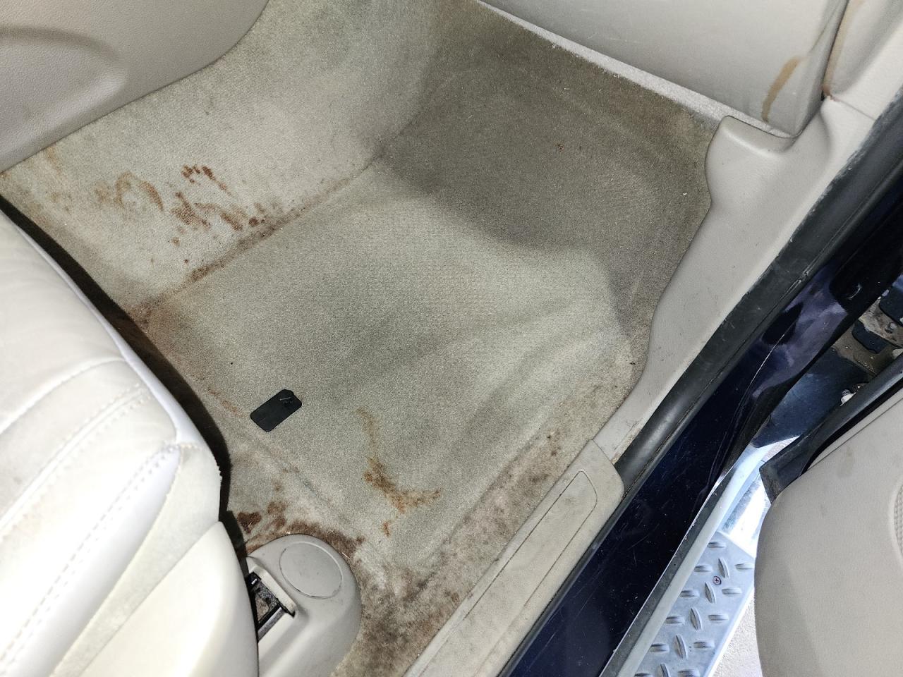 2012 Jeep Grand Cherokee Laredo Blue vin: 1C4RJFAG5CC285428 Damage: Right Front Carpet, Stained, Permanent