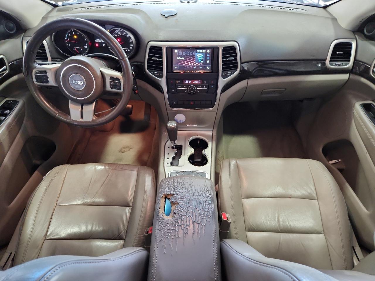 2012 Jeep Grand Cherokee Laredo Blue vin: 1C4RJFAG5CC285428 Damage: 2nd Row Center Console, Worn, Replacement Required